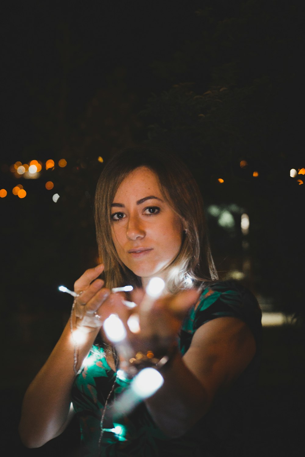 woman wearing green dress at night