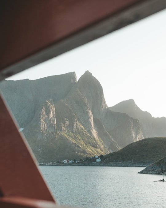 mountain surrounded by body of water in Reine Norway