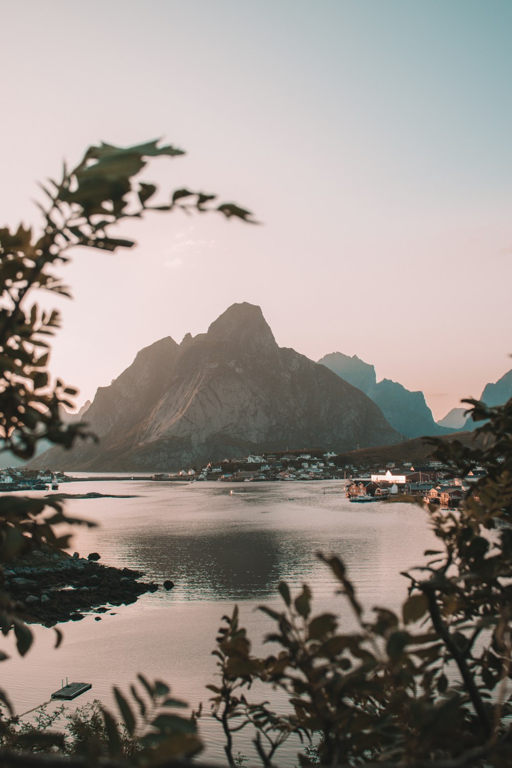 a body of water with a mountain in the background