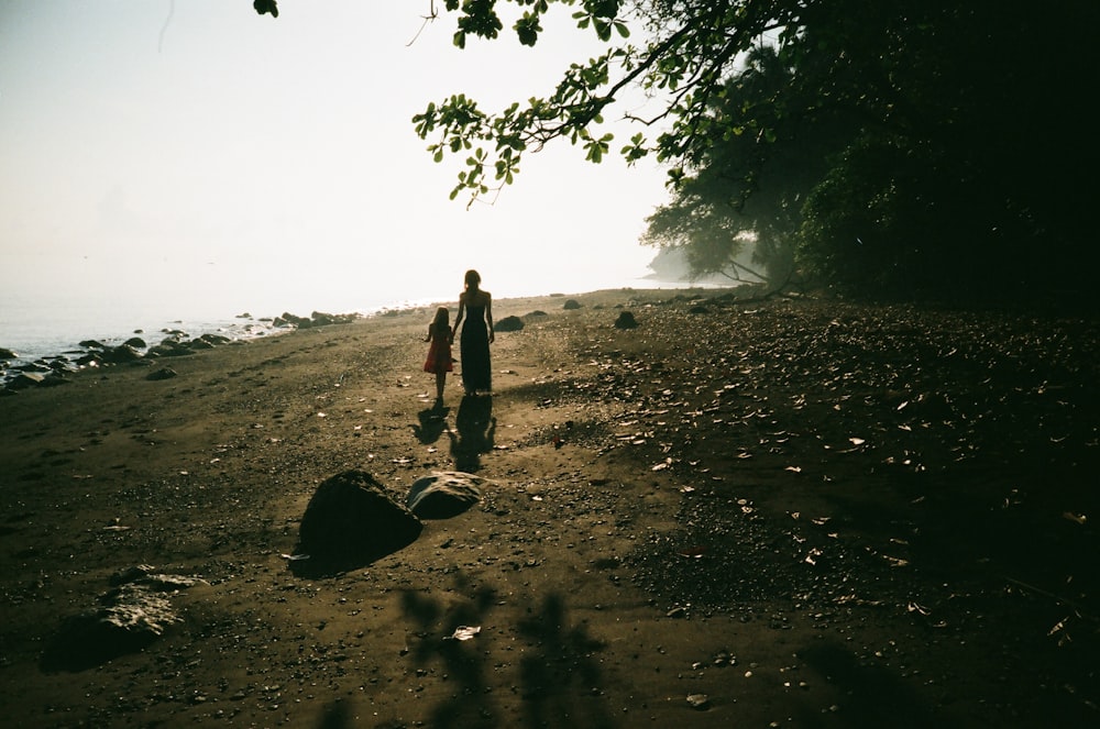 woman and girl on field