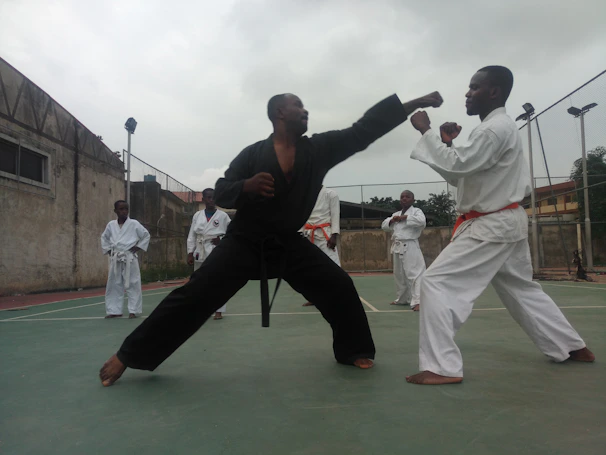 Students engaged in a friendly sparring match emphasizing technique and respect.