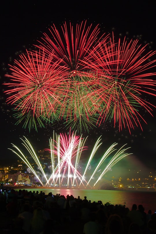 person showing fireworks gyro event in Blanes Spain