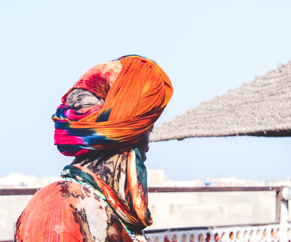 man wearing orange and pink turban