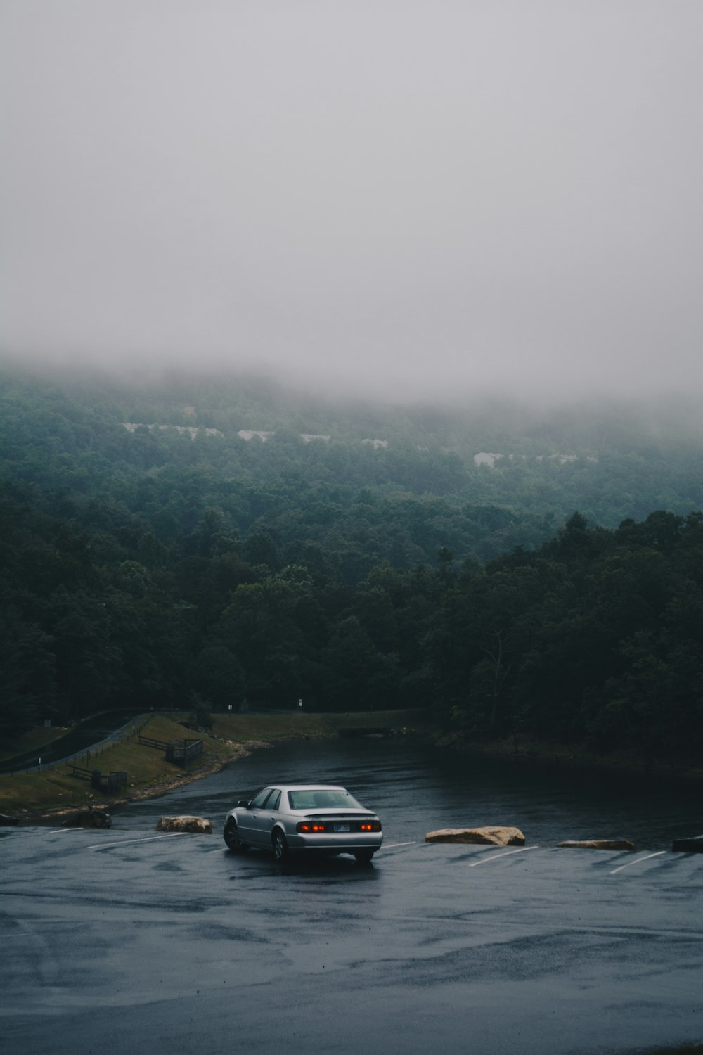 silver sedan on road