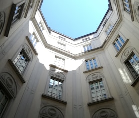 angle-view of white painted building under blue sky