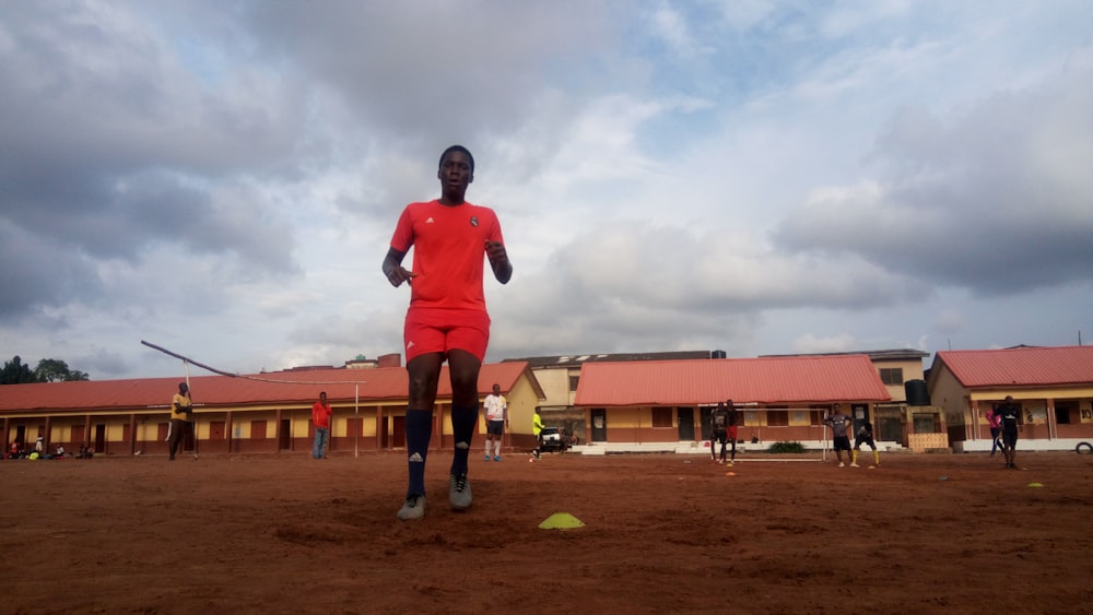 man wearing orange t-shirt