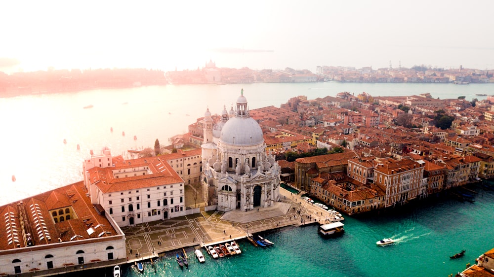 aerial photo of concrete buildings near calm water