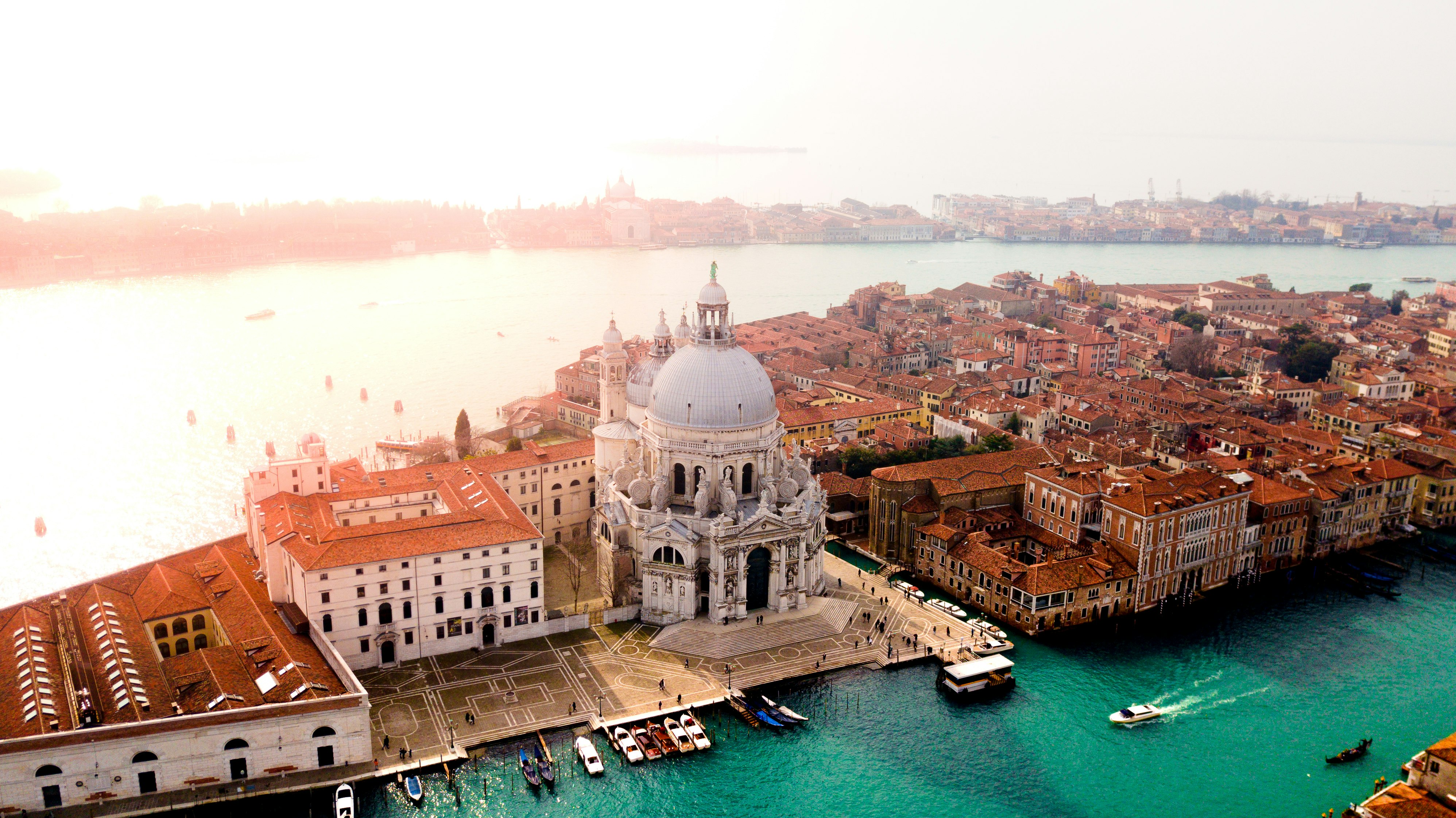 aerial photo of concrete buildings near calm water