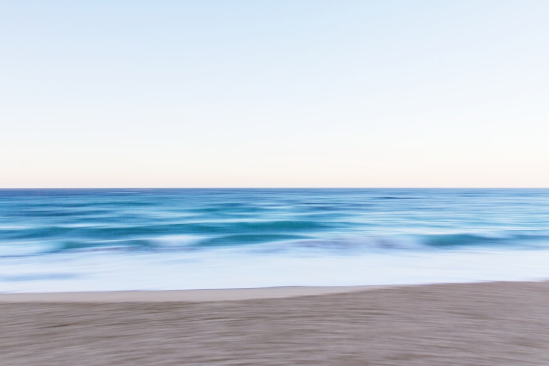 body of water near sand