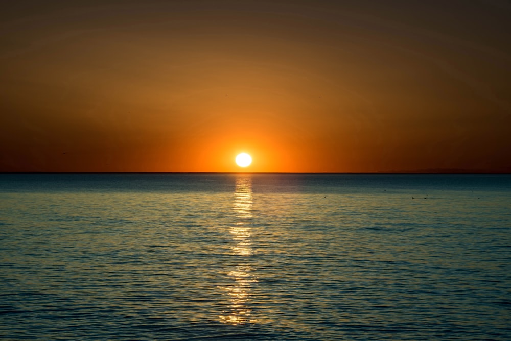 ocean during orange sunset