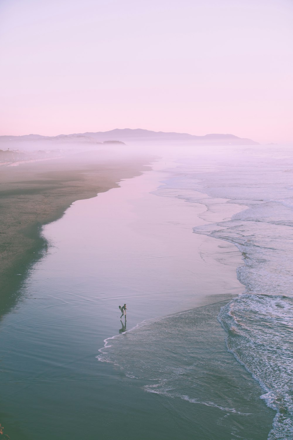person standing on seashore