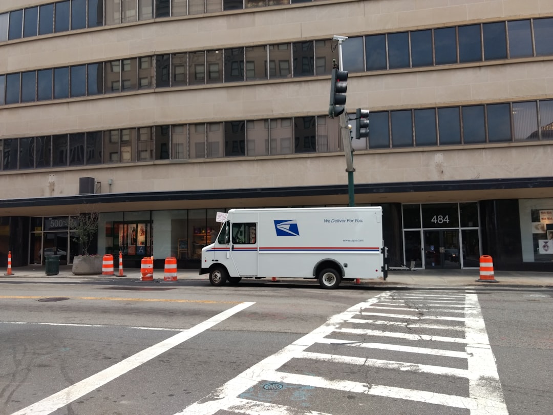 white van near concrete building,