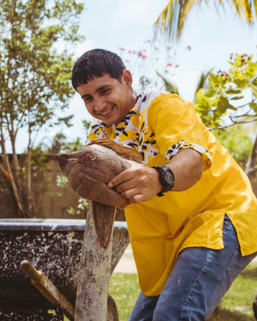 man holding coconut shell