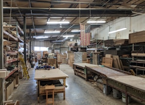 brown wooden table near hanging flag of U.S.A.