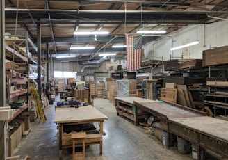 brown wooden table near hanging flag of U.S.A.