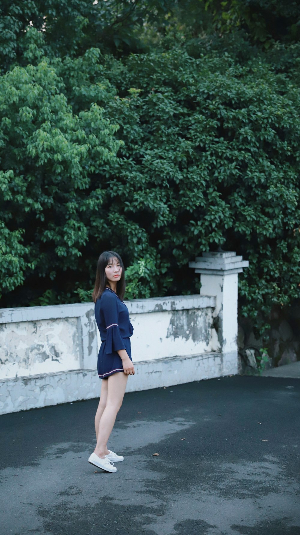 woman standing on concrete floor outdoor