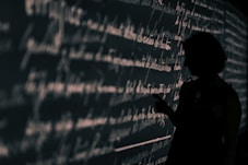 silhouette on person writing