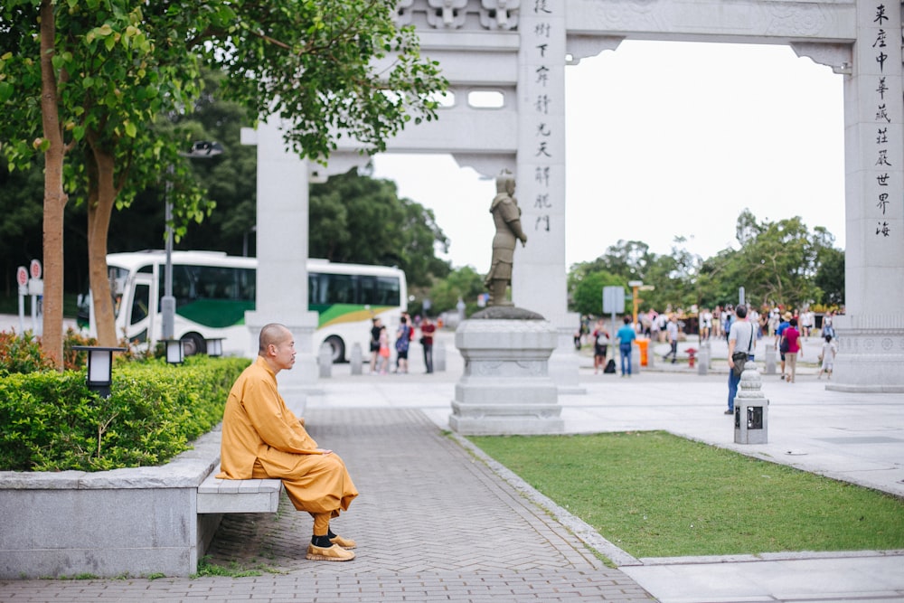 man sitting on bench