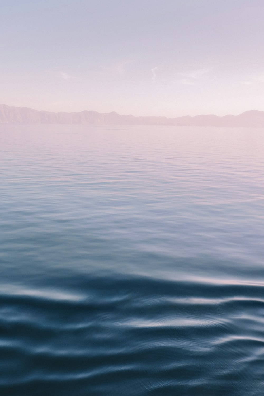 ocean under gray sky during daytime