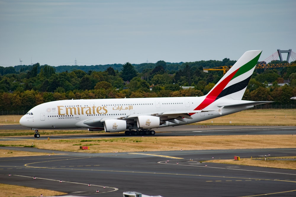 a large jetliner sitting on top of an airport runway