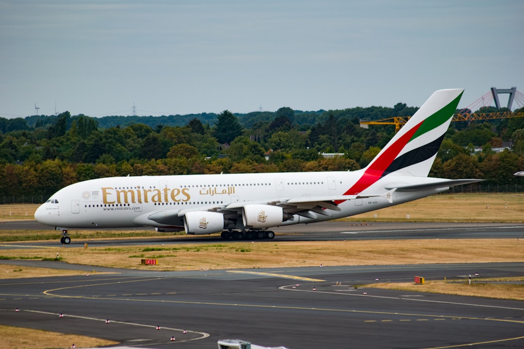 a large jetliner sitting on top of an airport runway,