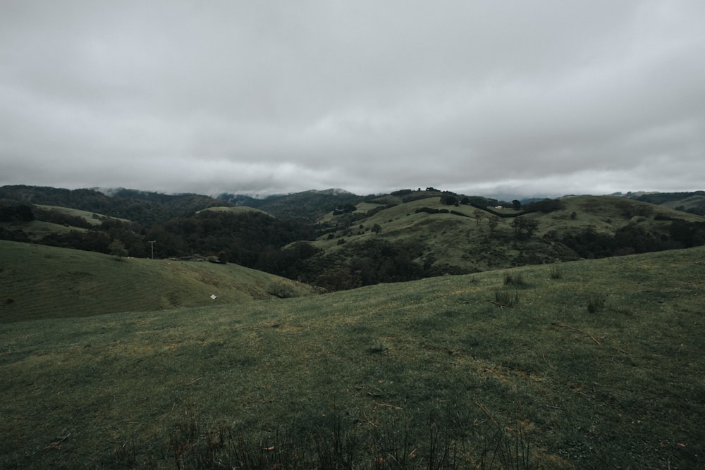 mountains under cloudy sky