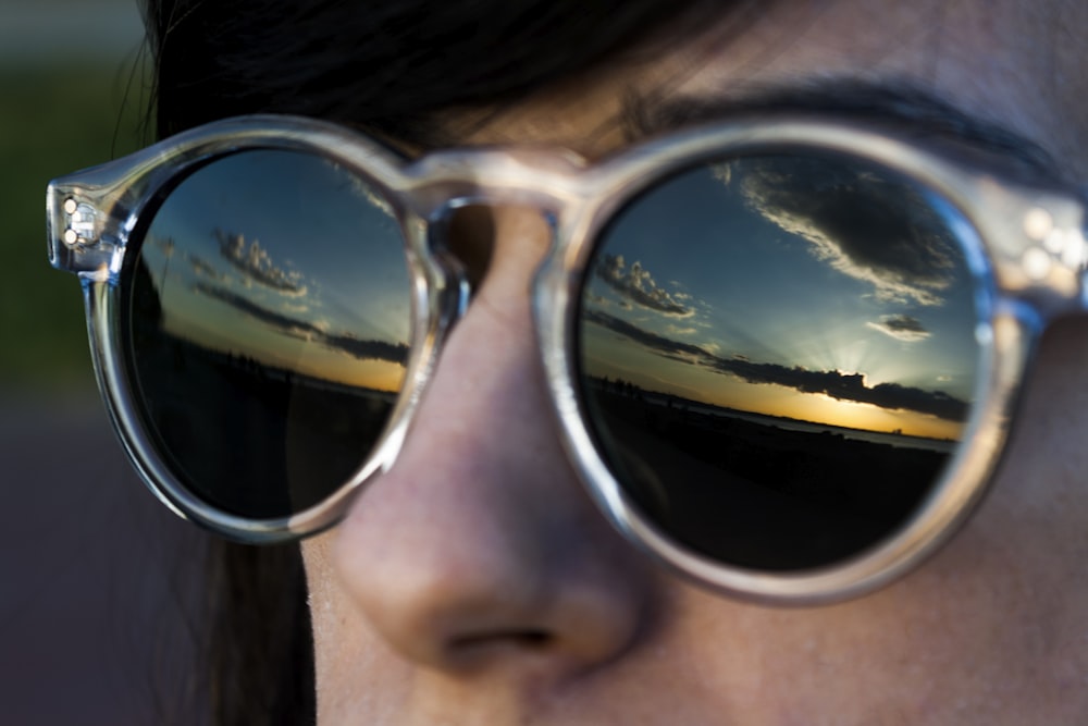 woman wearing black sunglasses with silver frames