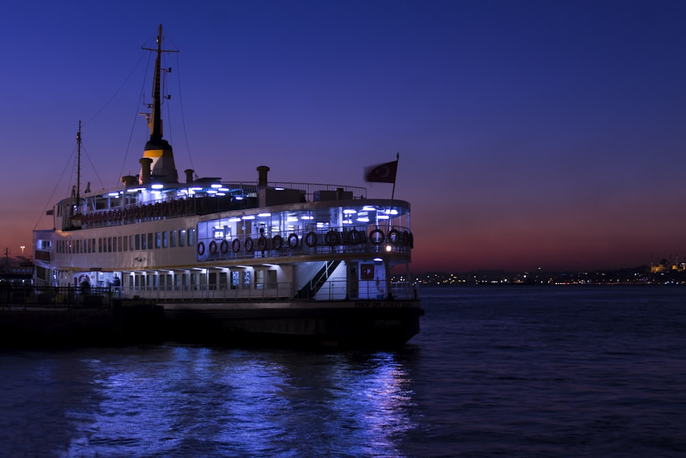 white and black ship on body of water