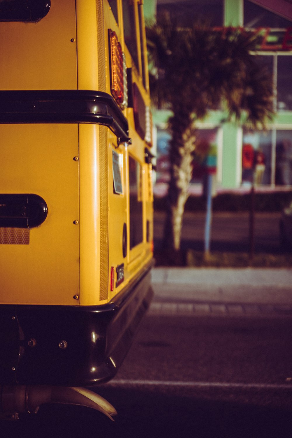 a yellow school bus parked on the side of the road