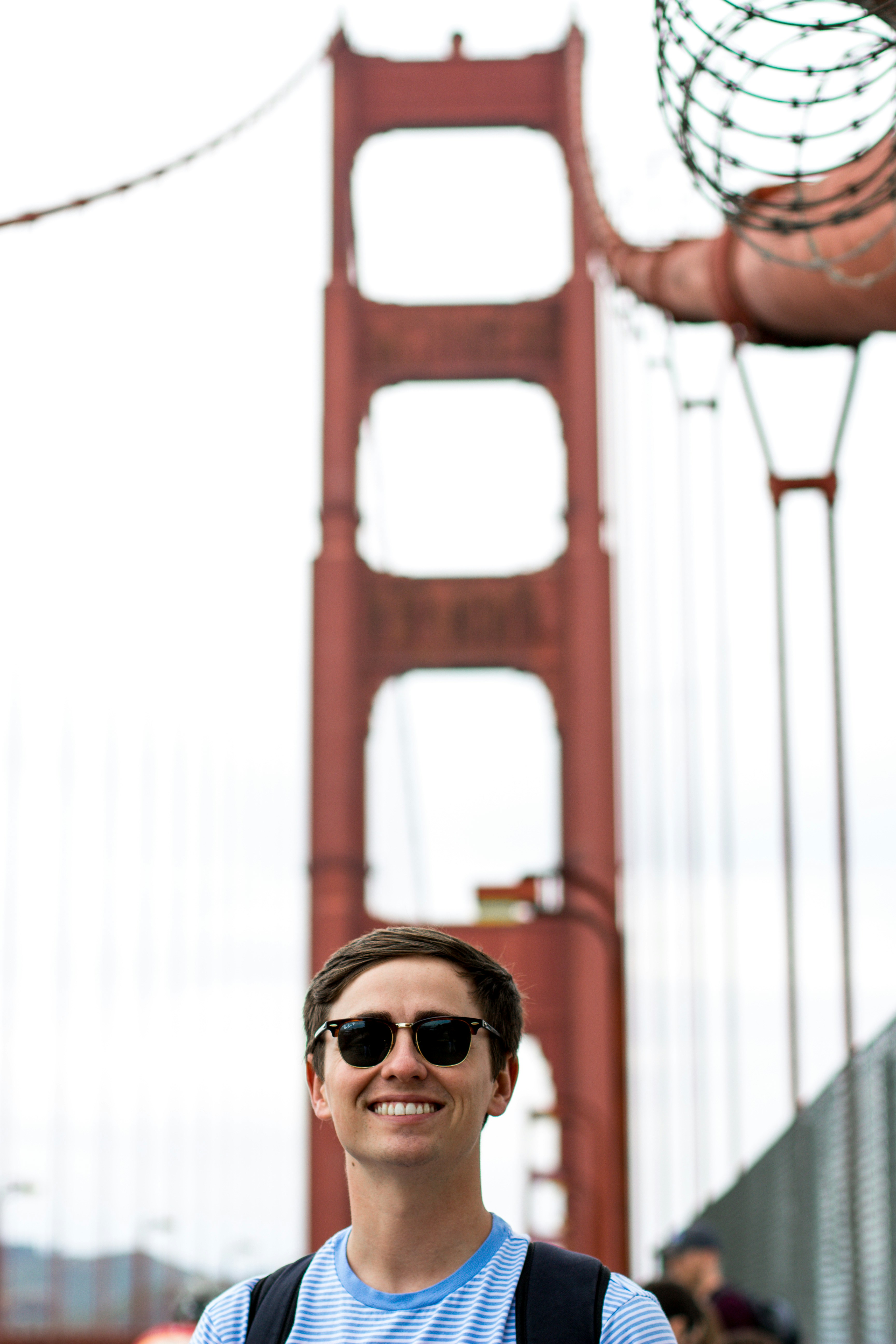 smiling man wearing black sunglasses