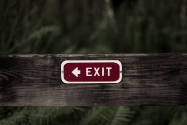 exit signage on wooden plank