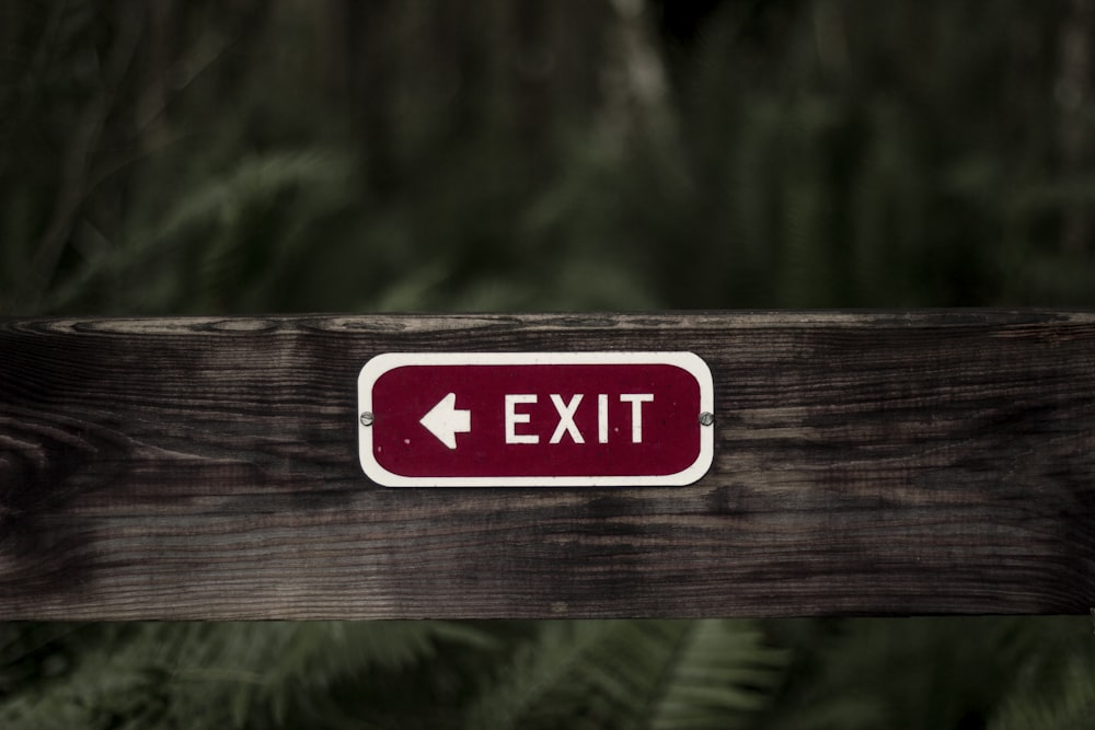 exit signage on wooden plank