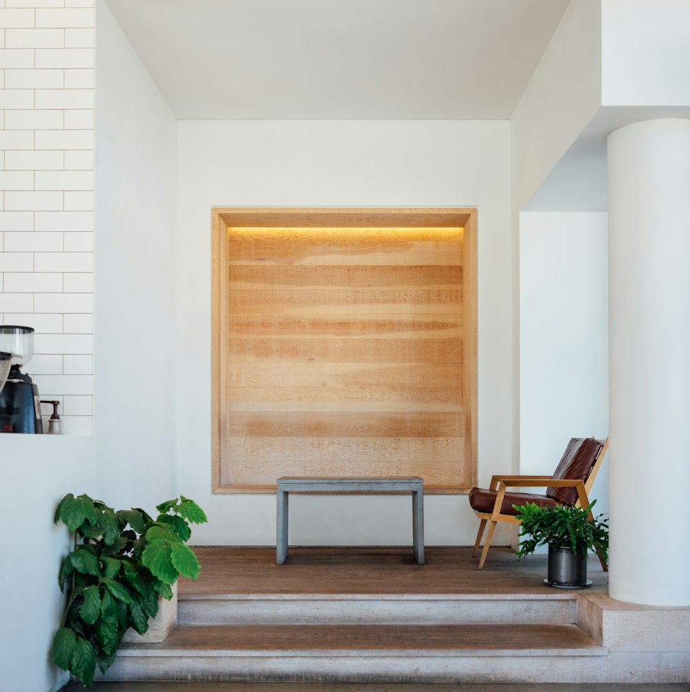 brown wooden board on white wall