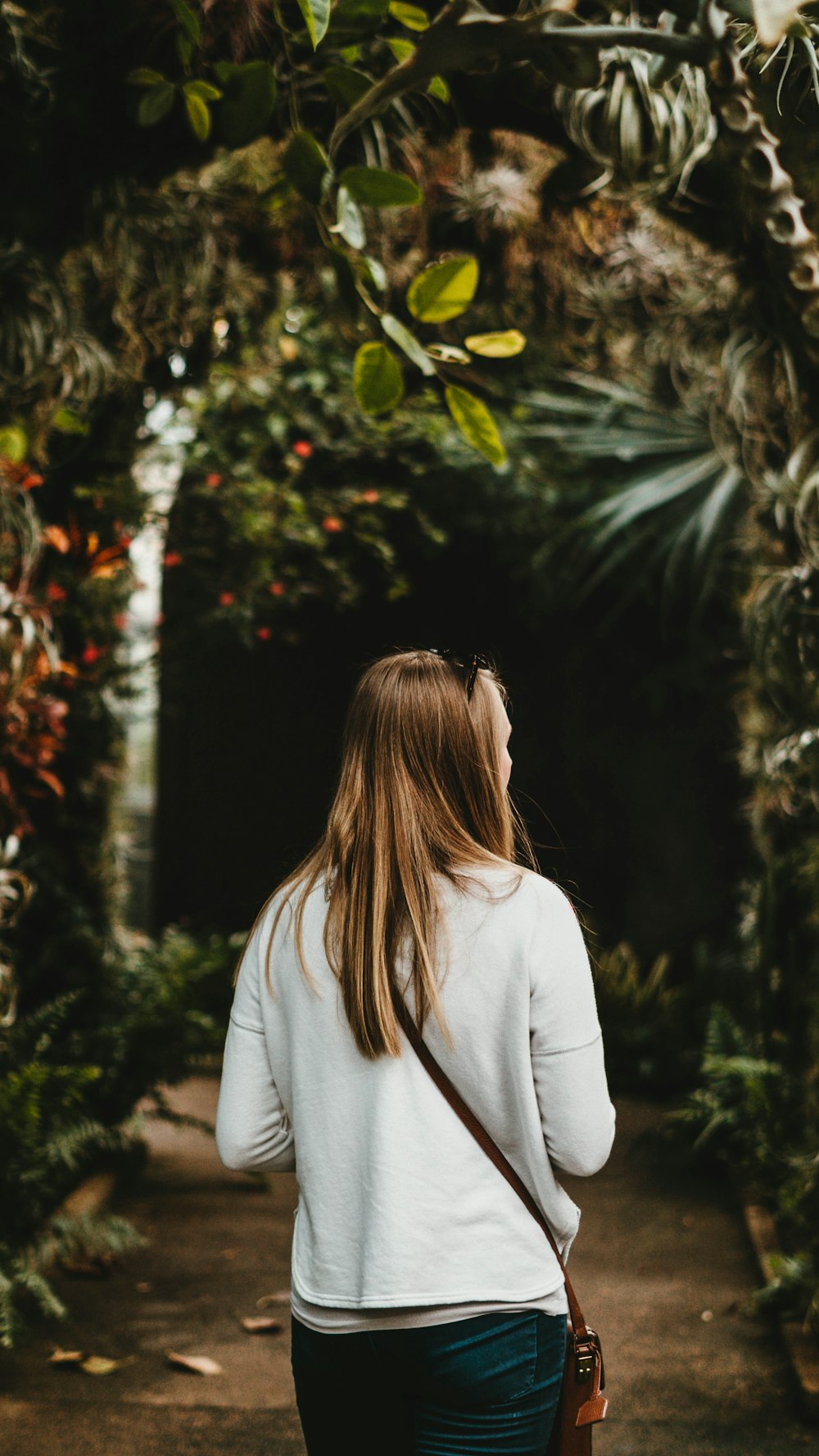 woman walking in brown garden