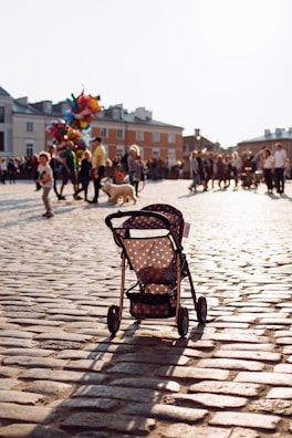 The stroller’s anti-tipping feature showcased on a sloped sidewalk.
