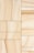 Rectangular sandstone tiles with natural beige and tan veining are arranged in a grid pattern. The tiles exhibit subtle variations in texture and color, creating a harmonious natural design.