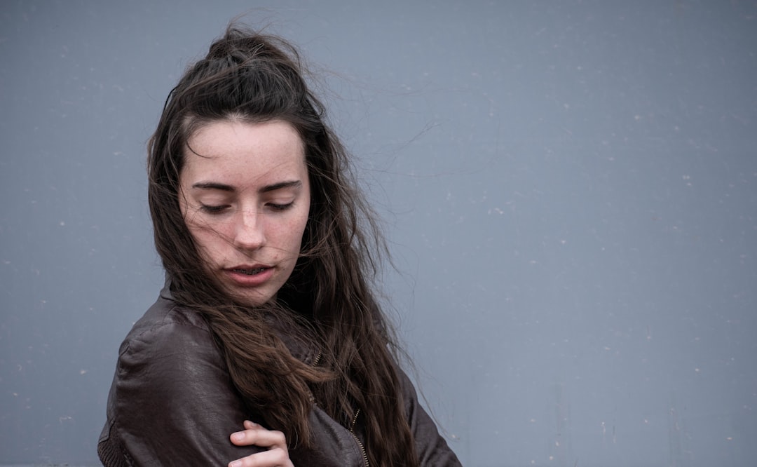 I was doing a shoot with my sister in a park and we found this great big grey garbage canister. It served as a good backdrop, especially because the sky was overcast so the shadows could really seep in and show the detail of her eyes and face.