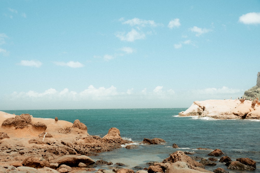 body of water and rock formation