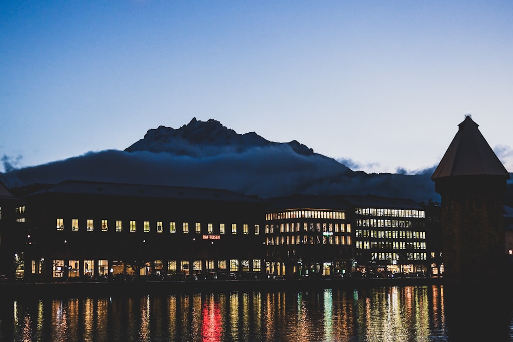 building near calm body of water