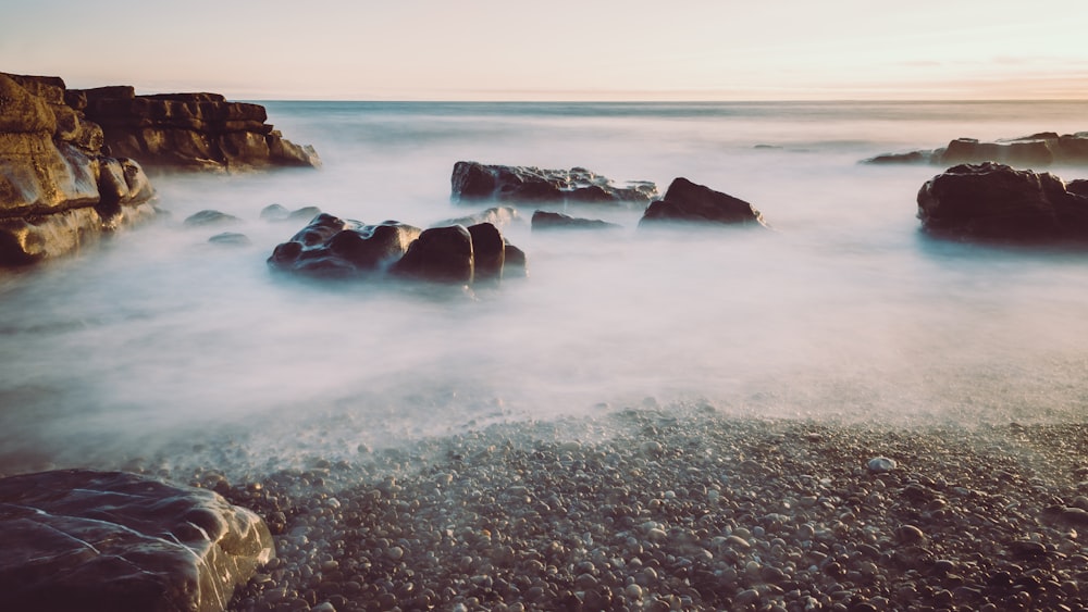 body of water covering with fog