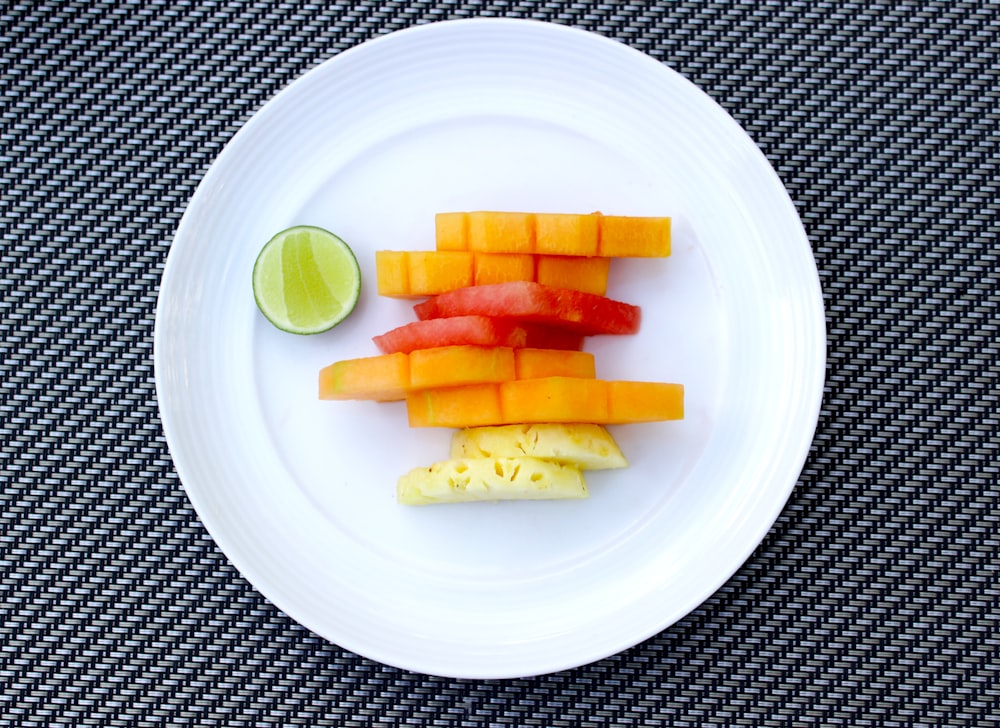 sliced of carrots and pineapple on plate