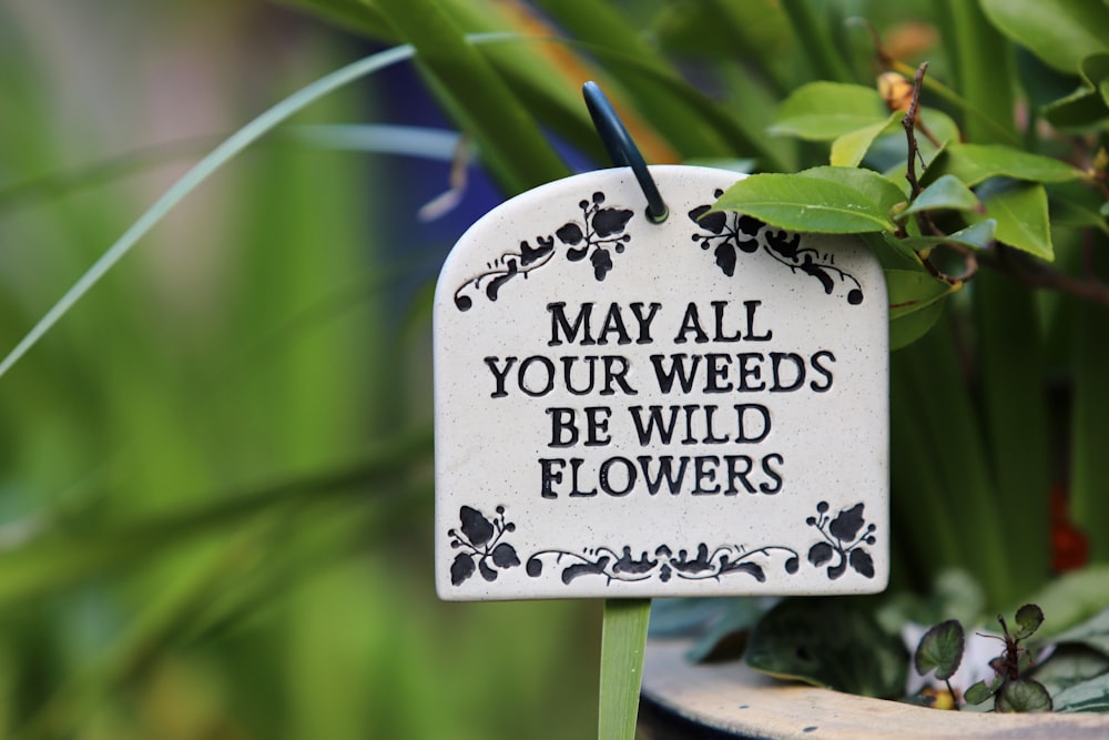 May All Your Weeds signage