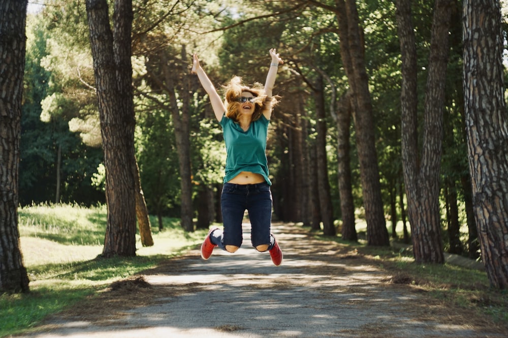 woman taking jump selfie