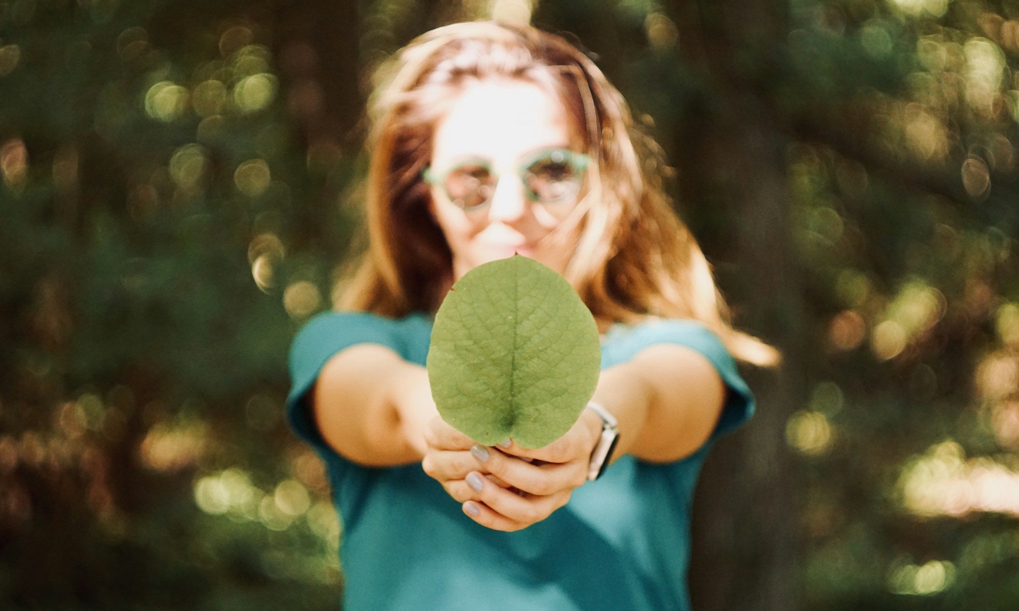 COP26 Climate summit. woman holding leaf