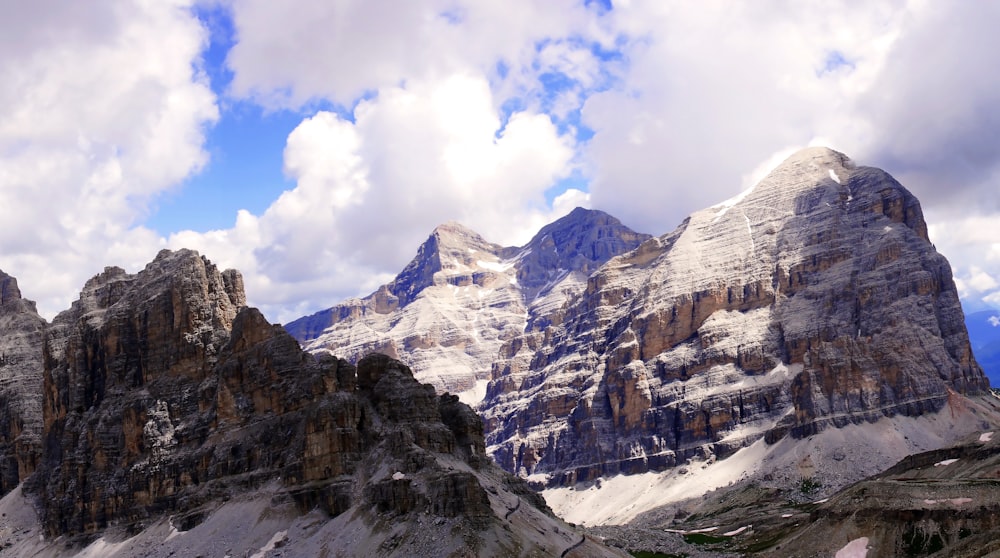 brown rocky mountains under white clouds