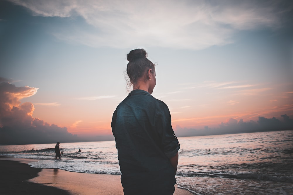 woman standing shoreline