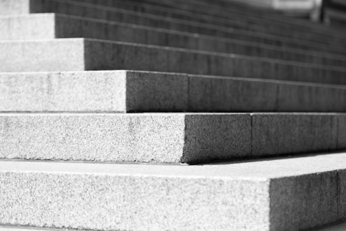 A clean construction site with concrete steps being installed.