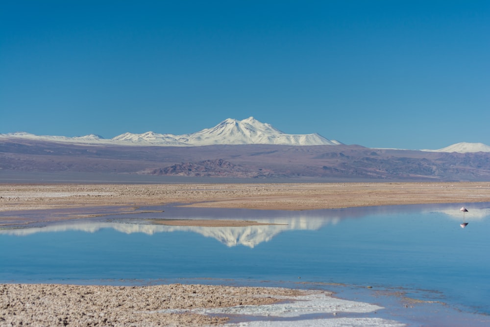 body of water near mountain