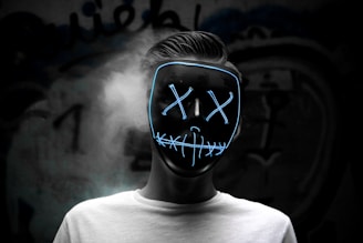 grayscale photo of man wearing mask