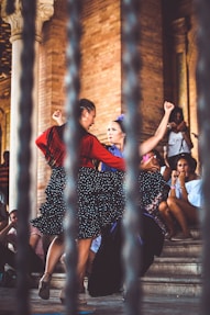 two women dancing outdoors